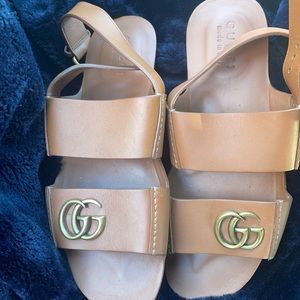 Brown Gucci sandals